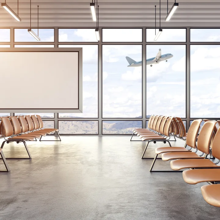 Airport waiting area with rows of seats