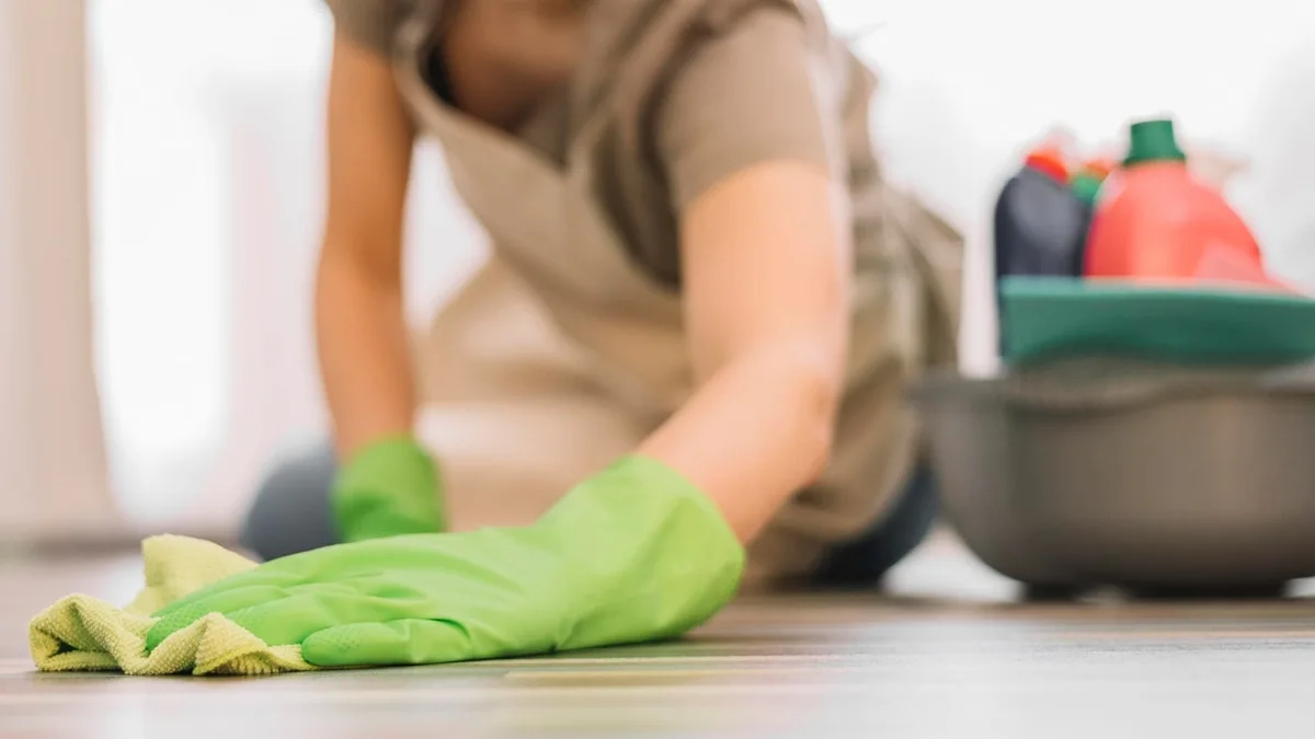 Cleaner wiping a countertop
