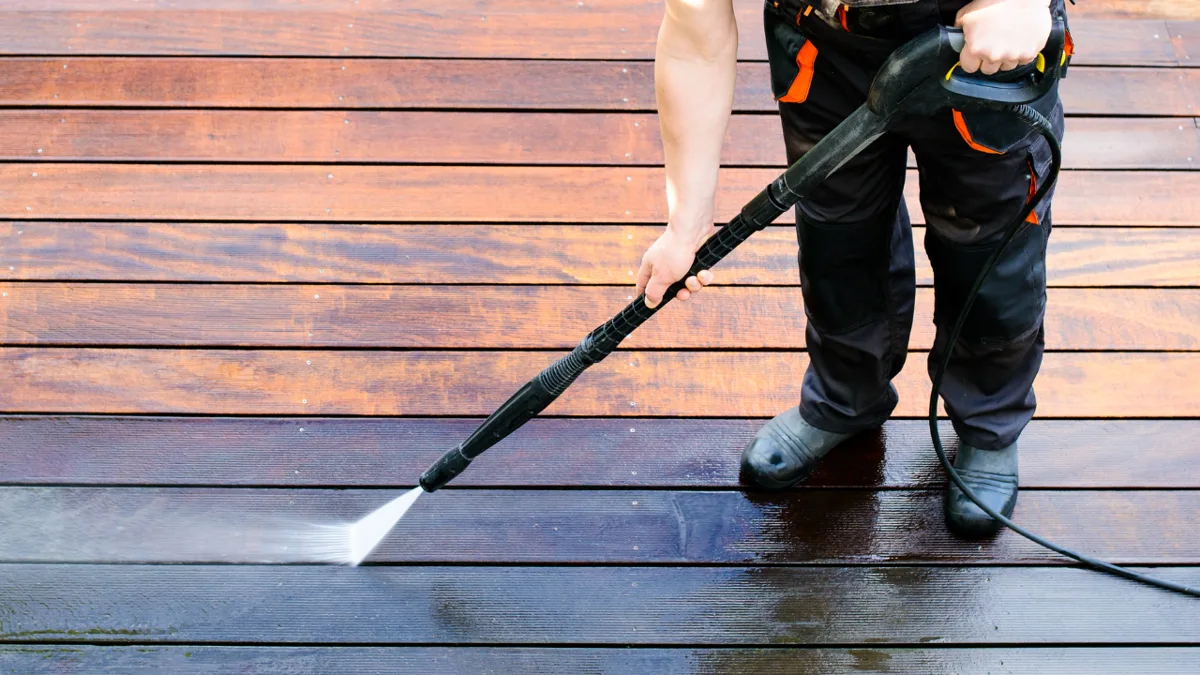 Pressure washing an exterior deck surface
